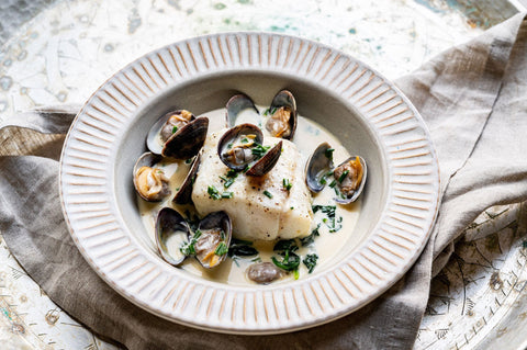 Cod with clams, cider and clotted cream sauce
